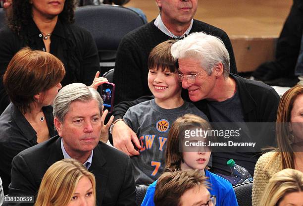 Carey Lowell, Homer James Gere and Richard Gere attend the Chicago Bulls VS New York Knicks at Madison Square Garden on February 2, 2012 in New York...