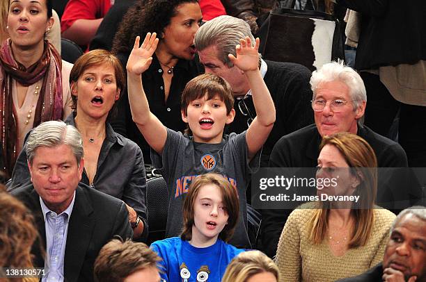 Carey Lowell, Homer James Gere and Richard Gere attend the Chicago Bulls VS New York Knicks at Madison Square Garden on February 2, 2012 in New York...