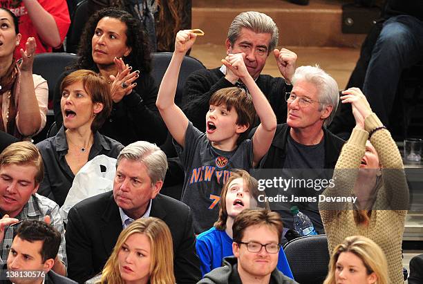 Carey Lowell, Homer James Gere and Richard Gere attend the Chicago Bulls VS New York Knicks at Madison Square Garden on February 2, 2012 in New York...