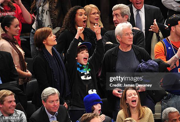 Carey Lowell, Homer James Gere and Richard Gere attend the Chicago Bulls VS New York Knicks at Madison Square Garden on February 2, 2012 in New York...