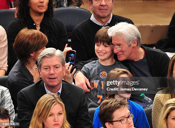 Carey Lowell, Homer James Gere and Richard Gere attend the Chicago Bulls VS New York Knicks at Madison Square Garden on February 2, 2012 in New York...