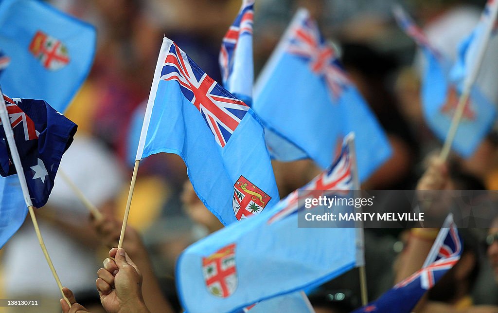 Fijian flags are waved during pool play