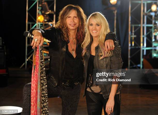 Steven Tyler and Carrie Underwood pose at the CMT Crossroads Live From "Pepsi Super Bowl Fan Jam" rehearsals at Indiana State Fairgrounds, Pepsi...