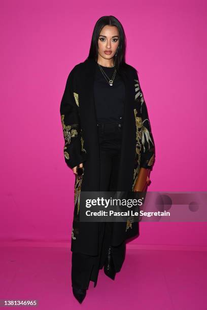 Amina Muaddi attends the Valentino Womenswear Fall/Winter 2022/2023 show as part of Paris Fashion Week on March 06, 2022 in Paris, France.