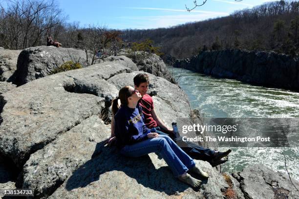 Cody Bouse of Alexandria and Rob Hutchison of Fairfax take in the view of Mather Gorge and the Potomac River as they take a break from hiking the...