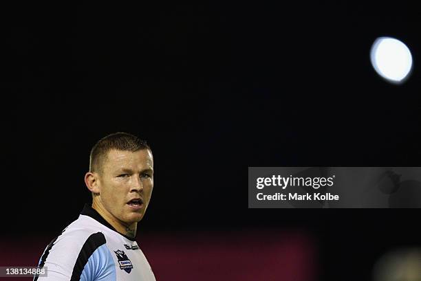 Todd Carney of the Sharks watches on during the NRL trial match between the Cronulla Sharks and the Manly Warringah Sea Eagles at Toyota Stadium on...