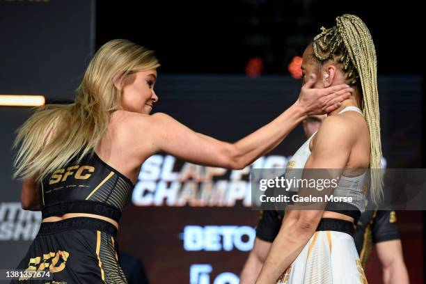 Adrianna “Flychanelle” Śledź slaps Julia Kruzer during the Slap Fighting Championships at the Arnold Sports Festival in Columbus Convention Center on...