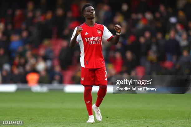 Bukayo Saka of Arsenal celebrates following their sides victory after the Premier League match between Watford and Arsenal at Vicarage Road on March...