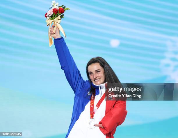 Silver medallist Marie Bochet of Team France poses during the Para Alpine Skiing Women’s Super G Standing medal ceremony on day two of the Beijing...