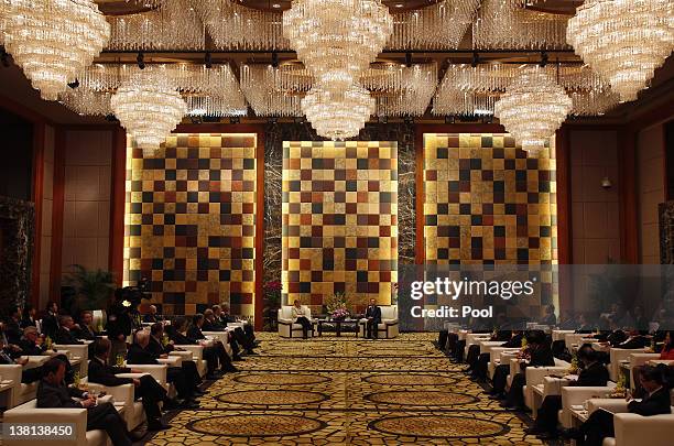 German Chancellor Angela Merkel and Chinese Premier Wen Jiabao attend a meeting with German and Chinese businessmen during their visit to Guangzhou...