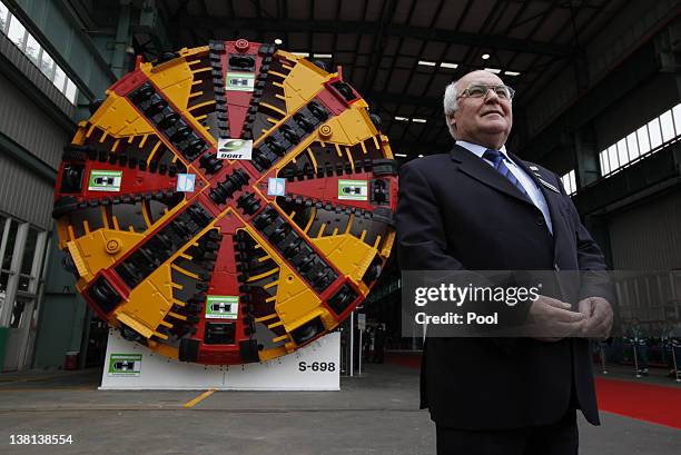 Martin Herrenknecht, Chairman of the Board of Management of Herrenknecht AG, poses in front of a tunnelling system before the arrival of German...