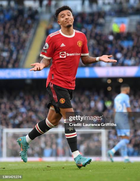 Jadon Sancho of Manchester United celebrates after scoring their sides first goal during the Premier League match between Manchester City and...