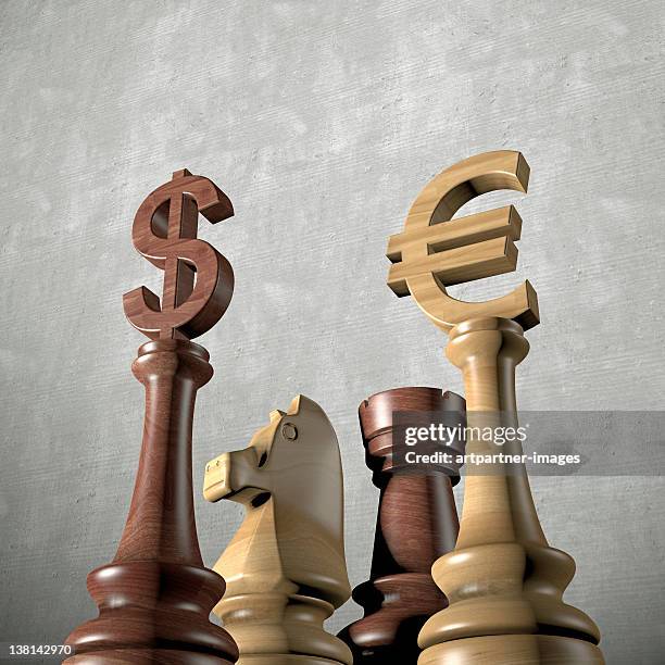 euro and dollar as kings in a chess game - schachfigur stock-fotos und bilder