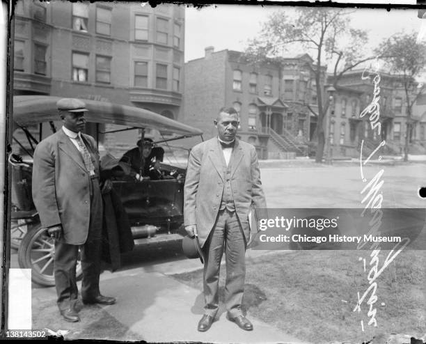 View of American educator, economist, and industrialist Booker T Washington , founder of the Tuskegee Institute in Alabama, as he stands on a...