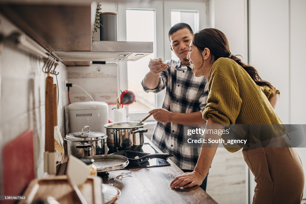 Man cooking for wife