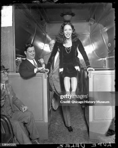 Lupe Velez, actress, bracing her hands on two low counters, Chicago, Illinois, 1929.