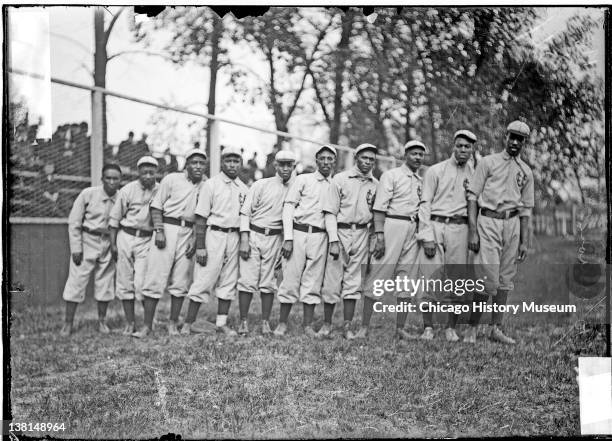 Negro National League's Chicago American Giants baseball team players standing on the field, Chicago, Illinois, 1911.