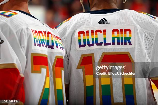 Patric Hornqvist and Anthony Duclair of the Florida Panthers wear a colorful Pride Night jersey for warm ups prior to the start of the game against...