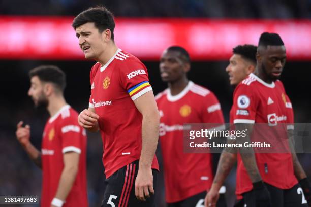 Harry Maguire of Manchester United reacts after Riyad Mahrez of Manchester City scores their sides third goal during the Premier League match between...