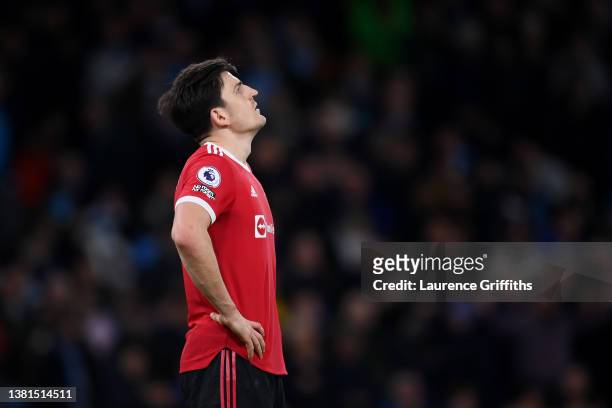 Harry Maguire of Manchester United looks dejected during the Premier League match between Manchester City and Manchester United at Etihad Stadium on...