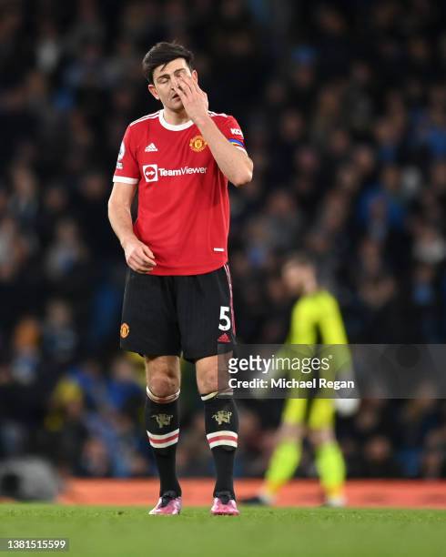 Harry Maguire of Manchester United looks dejected during the Premier League match between Manchester City and Manchester United at Etihad Stadium on...