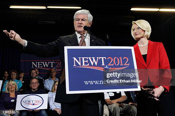 Republican presidential candidate and former Speaker of the House Newt Gingrich is accompanied by his wife Callista Gingrich as he speaks at a...