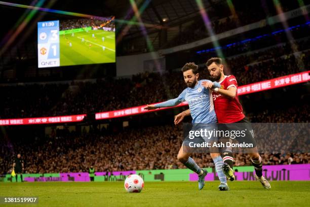 Bruno Fernandes of Manchester United competes for the ball with Bernado Silva of Manchester City during the Premier League match between Manchester...
