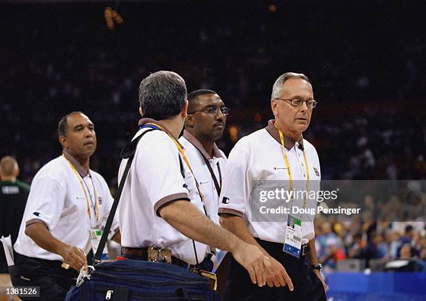 Assistant coach Larry Brown leads the other assistant coaches onto the floor before the men's semifinal game against Lithuania at the Sydney...