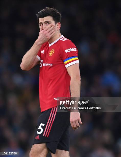 Harry Maguire of Manchester United looks dejected following their sides defeat after the Premier League match between Manchester City and Manchester...