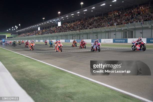 The MotoGP riders start from the grid during the MotoGP race during the MotoGP of Qatar at Losail Circuit on March 06, 2022 in Doha, Qatar.