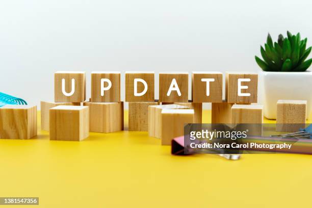 update text on wood blocks - concept updates stock pictures, royalty-free photos & images