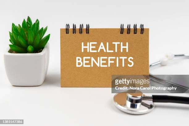 health benefits text with  stethoscope - health care and medical concept - employee benefits stock pictures, royalty-free photos & images