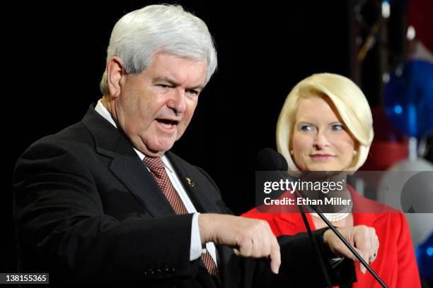 Republican presidential candidate and former Speaker of the House Newt Gingrich is accompanied by his wife Callista Gingrich as he speaks at a...