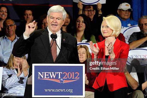 Republican presidential candidate and former Speaker of the House Newt Gingrich is accompanied by his wife Callista Gingrich as he speaks at a...