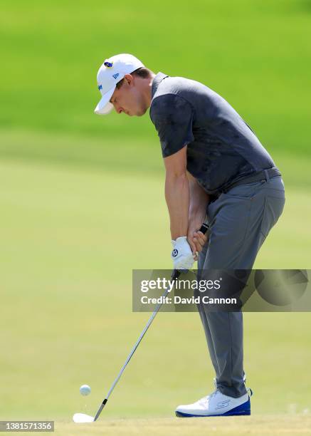 Matthew Fitzpatrick of England chips with a reverse hand grip for his third shot on the par 4, first hole during the final round of the Arnold Palmer...