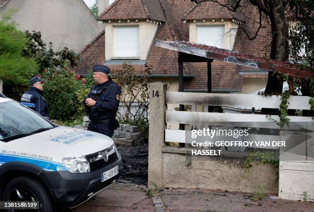 Municipal police officers stand in front of the damaged home of the Mayor of l'Hay-les-Roses Vincent Jeanbrun, in l'Hay-les-Roses, a suburb of Paris...