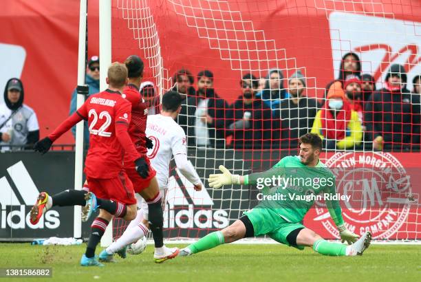 Alex Bono of Toronto FC fails to stop Lewis Morgan of New York Red Bulls scoring his third goal during the first half of an MLS game at BMO Field on...