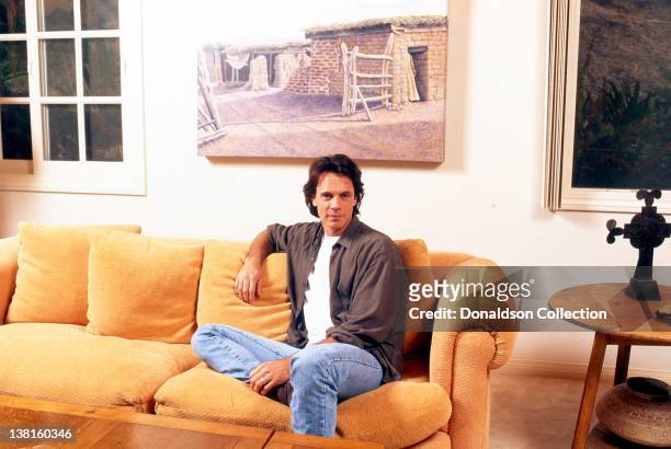 Singer-songwriter Rick Springfield poses at his home in circa1990 in Los Angeles, California.