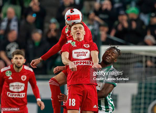 Fortune Bassey of Ferencvarosi TC battles for the ball in the air News  Photo - Getty Images