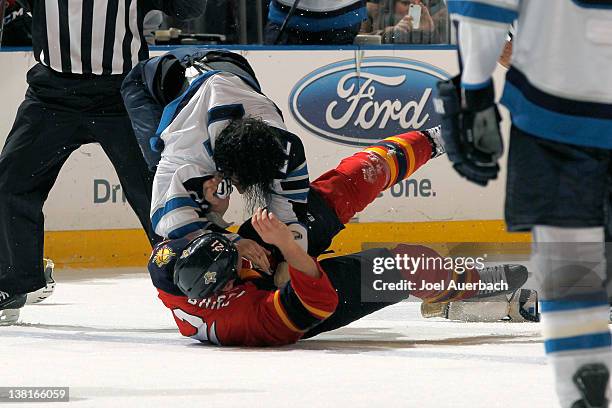 Krystofer Barch of the Florida Panthers and Chris Thorburn of the Winnipeg Jets fight during the second period on February 3, 2012 at the...