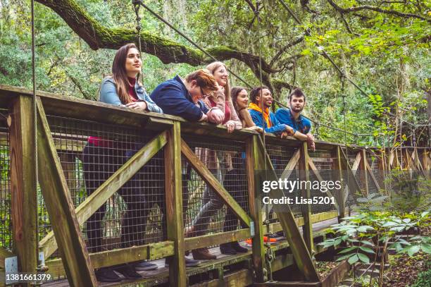 diverse candid happy group of young friends in tropical scenic outdoors, youth group or club or maybe team building or travel vacation tour group - gap year stock pictures, royalty-free photos & images