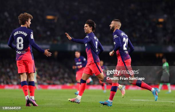 Joao Felix of Atletico Madrid celebrates with team mates Antoine Griezmann and Yannick Ferreira Carrasco after scoring their sides second goal during...