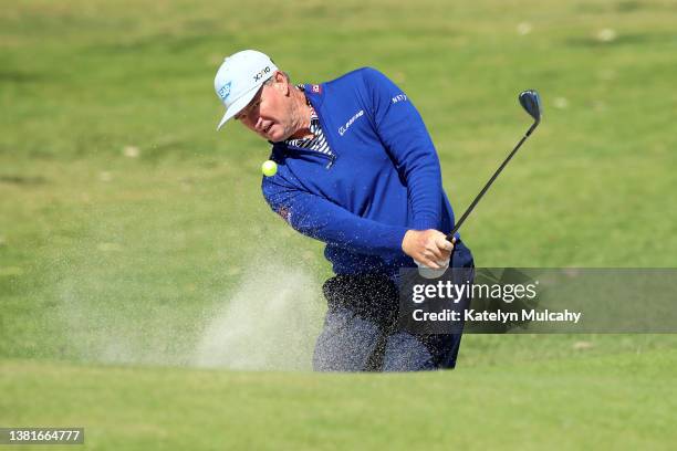 Ernie Els of South Africa plays a shot from a bunker on the fifth hole during the final round at Newport Beach Country Club on March 06, 2022 in...