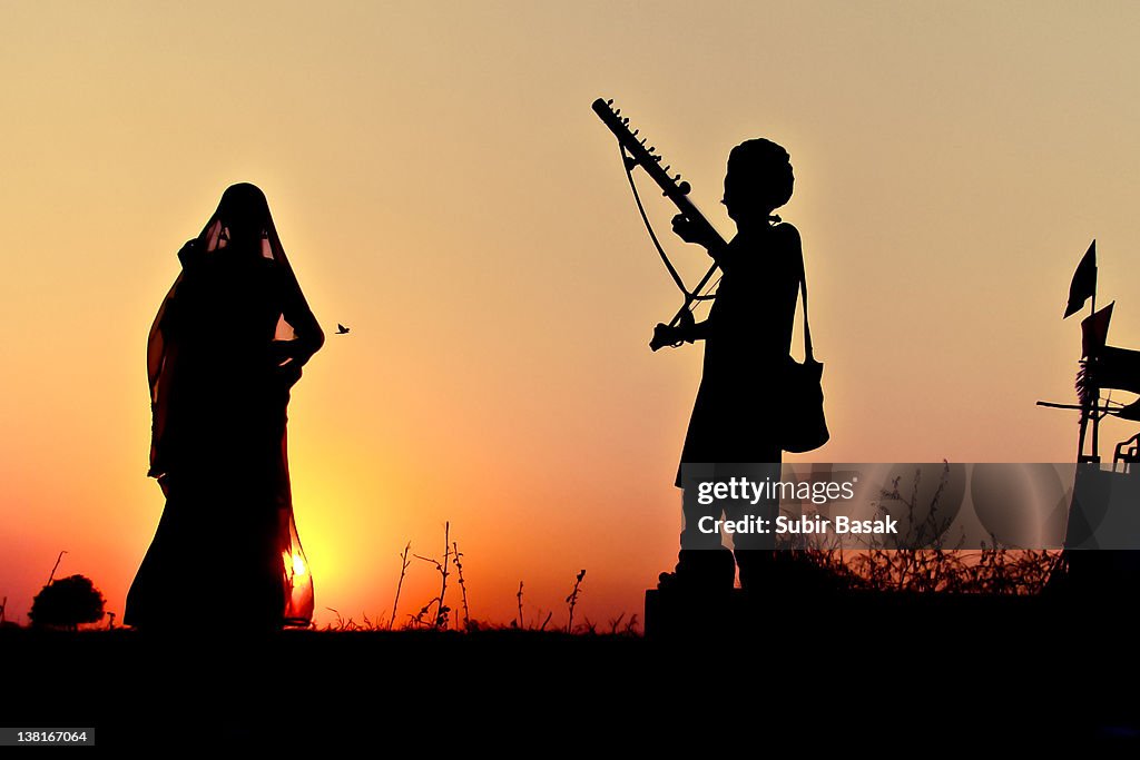 Silhouette of dancer and musician