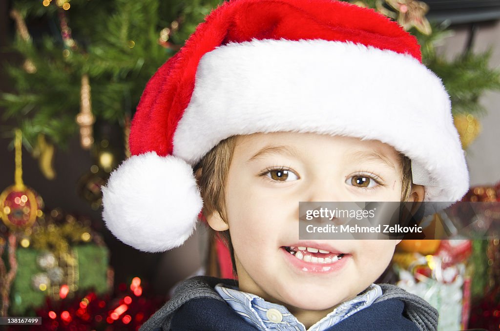 Adorable little kid with Santa Hat