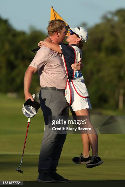 Ryan Brehm and his caddie and wife Chelsey Brehm react after putting in to win on the 18th green during the final round of the Puerto Rico Open at...