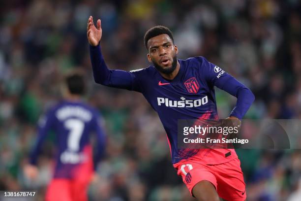 Thomas Lemar of Atletico Madrid celebrates after scoring their sides third goal during the LaLiga Santander match between Real Betis and Club...