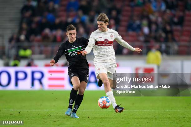 Florian Neuhaus of Moenchengladbach battles for possession with Borna Sosa of Stuttgart during the Bundesliga match between VfB Stuttgart and...