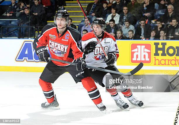 Ryan Murray of Team Cherry is checked by Scott Kosmachuk of Team Orr at the 2012 Home Hardware CHL NHL Top Prospects Game at Prospera Place on...