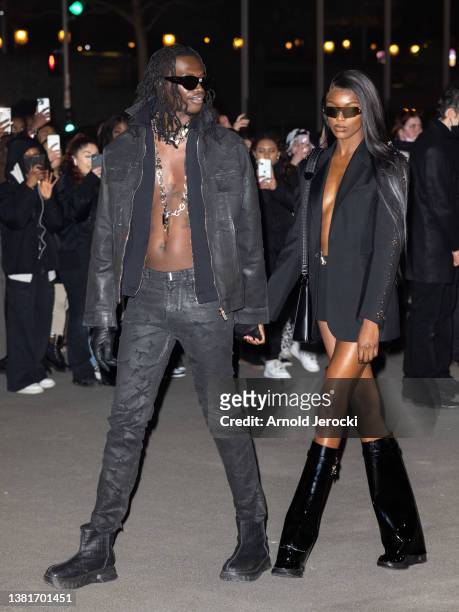 Leomie Anderson and Lancey Foux attends the Givenchy Womenswear Fall/Winter 2022/2023 show as part of Paris Fashion Week on March 06, 2022 in Paris,...